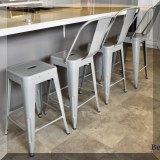 F31. Set of 4 contemporary metal counter stools.